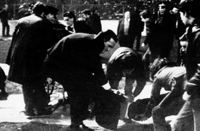Celtic manager Jock Stein helping the injured at the Ibrox disaster in 1971