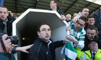 Celtic manager Martin O'Neill is mobbed by supporters