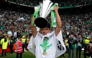 Celtic's Oh Hyeon-gyu celebrates with the trophy