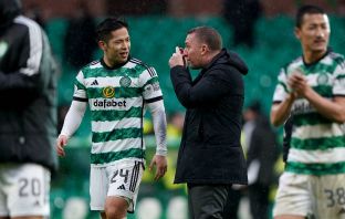 Brendan Rodgers speaks with Tomoki Iwata