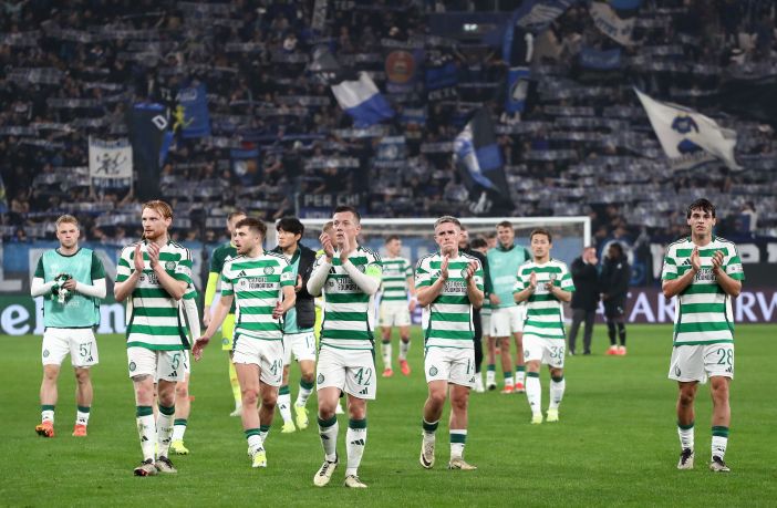 Celtic players applaud the fans