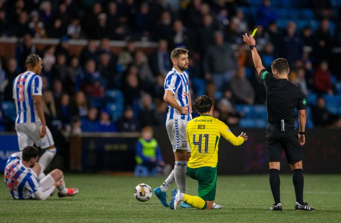 Nick Walsh shows Reo Hatate a yellow card.