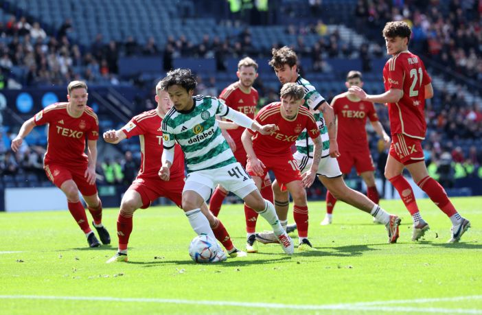 Reo Hatate runs with the ball from Leighton Clarkson