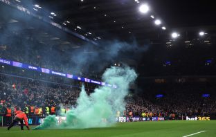 Green flare on the pitch at Villa Park