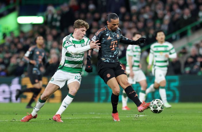 Leroy Sane is challenged by Arne Engels