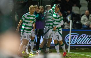 Yang celebrates with his delighted teammates.