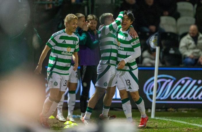 Yang celebrates with his delighted teammates.