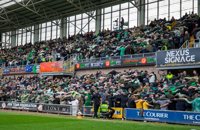 Celtic supporters doing the Huddle