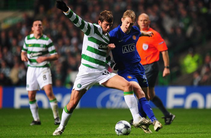 Massimo Donati of Celtic battles for the ball with Darren Fletcher of Manchester United