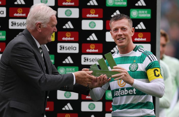 Callum McGregor of Celtic is presented with the Adidas Trophy by Roy Aitken