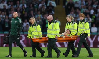 Alistair Johnston of Celtic is stretchered off