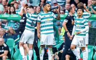 Kieran Tierney of Celtic applauds the fans