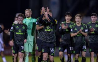 Celtic players applaud the Celtic support