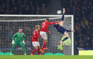 Scott McTominay of Scotland scores