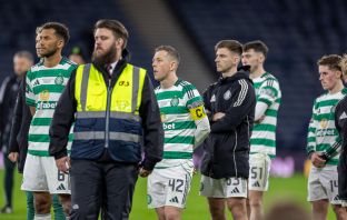 Auston Trusty and Callum McGregor look on.