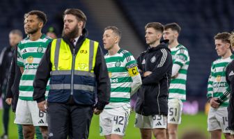 Auston Trusty and Callum McGregor look on.