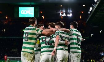 Celtic players celebrate the third goal by James Forrest.