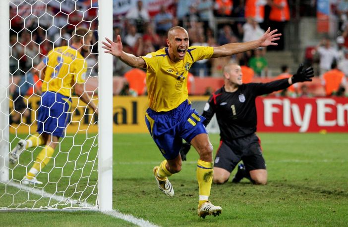 Henrik Larsson of Sweden celebrates scoring against England