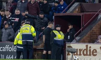Referee Steven McLean viewing the footage on VAR screen.