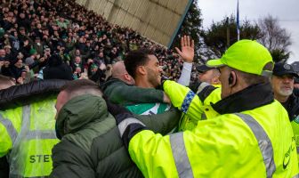 Auston Trusty celebrates with the Celtic supporters.