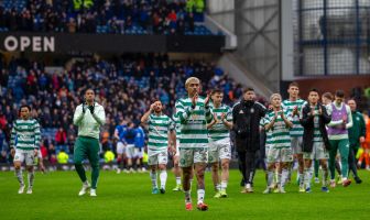 Celtic players applaud the Celtic support.