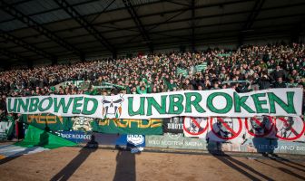 Unbowed. Unbroken - The Celtic support at Dens Park.